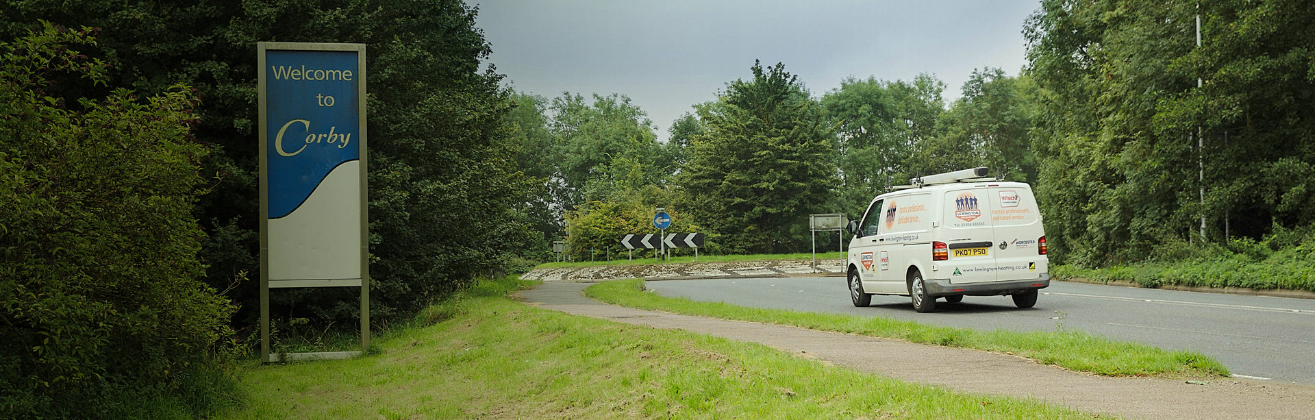 Plumbers van driving into Corby